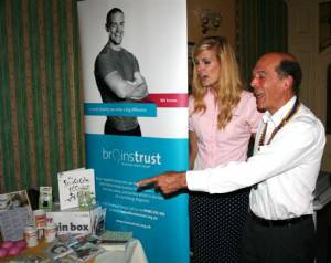 Brainstrust Fundraiser Frances Milburn explains to Rotary Club of Buxton President, Andrew Heywood, the practical resources that the Brainstrust charity use to help brain cancer patients understand their illness and cope. 